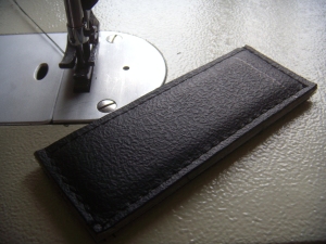 Foam padding sewn between non-slip surface and HDPE backing.